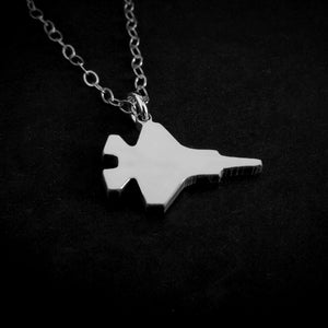 Sterling Silver F-35 Military Fighter Jet pendant on a chain against a black background