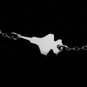 F-35 Military Fighter Jet Inline Necklace in sterling silver against a dark background