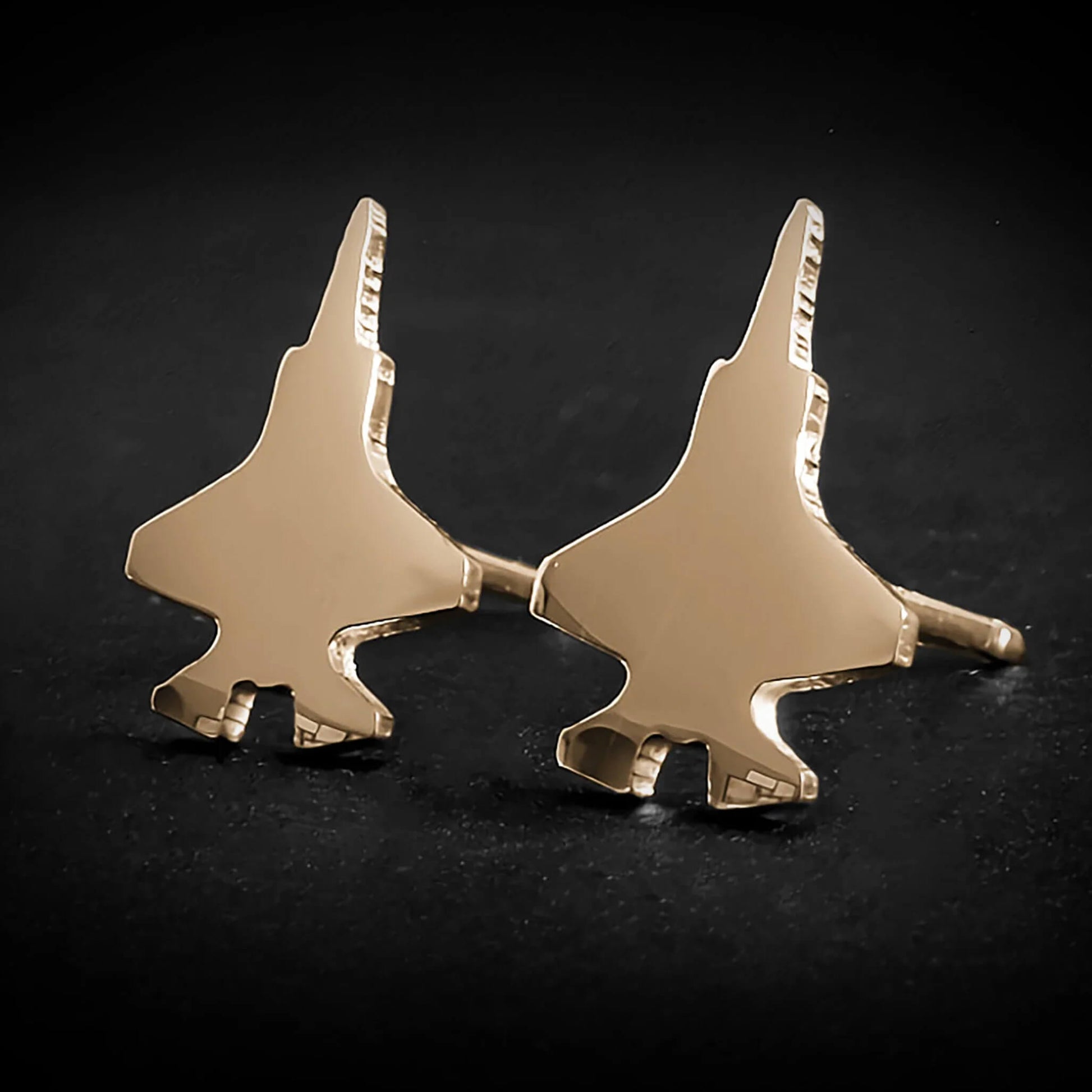 Pair of f-35 military jet silhouette stud earrings crafted in 14K gold