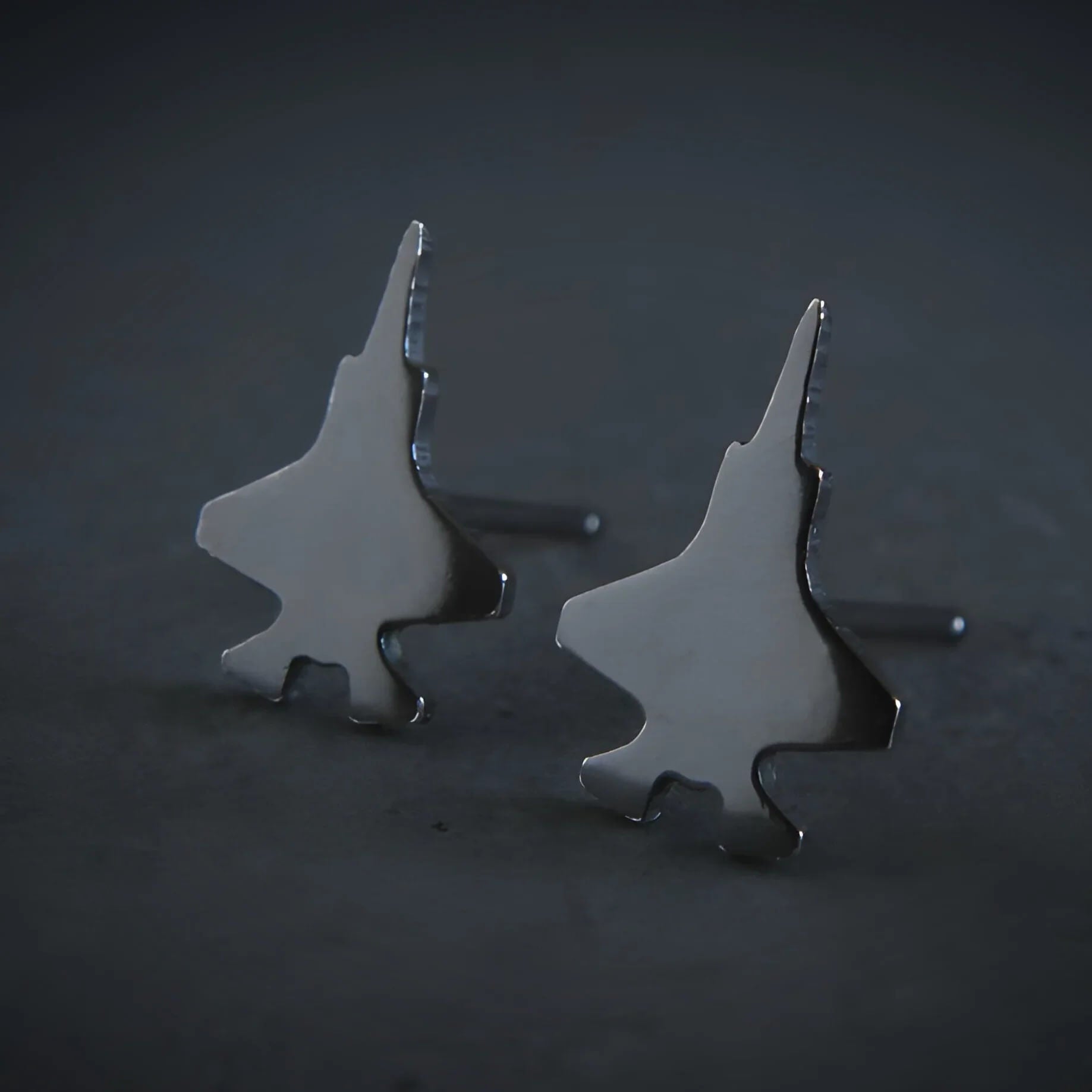F-35 military jet-shaped stud earrings with a dark oxidized finish