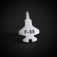 Silver F-35 fighter jet military jet aircraft tie pin on a black background