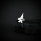 Sterling Silver Tie Pin of an F-35 military fighter jet on a dark background