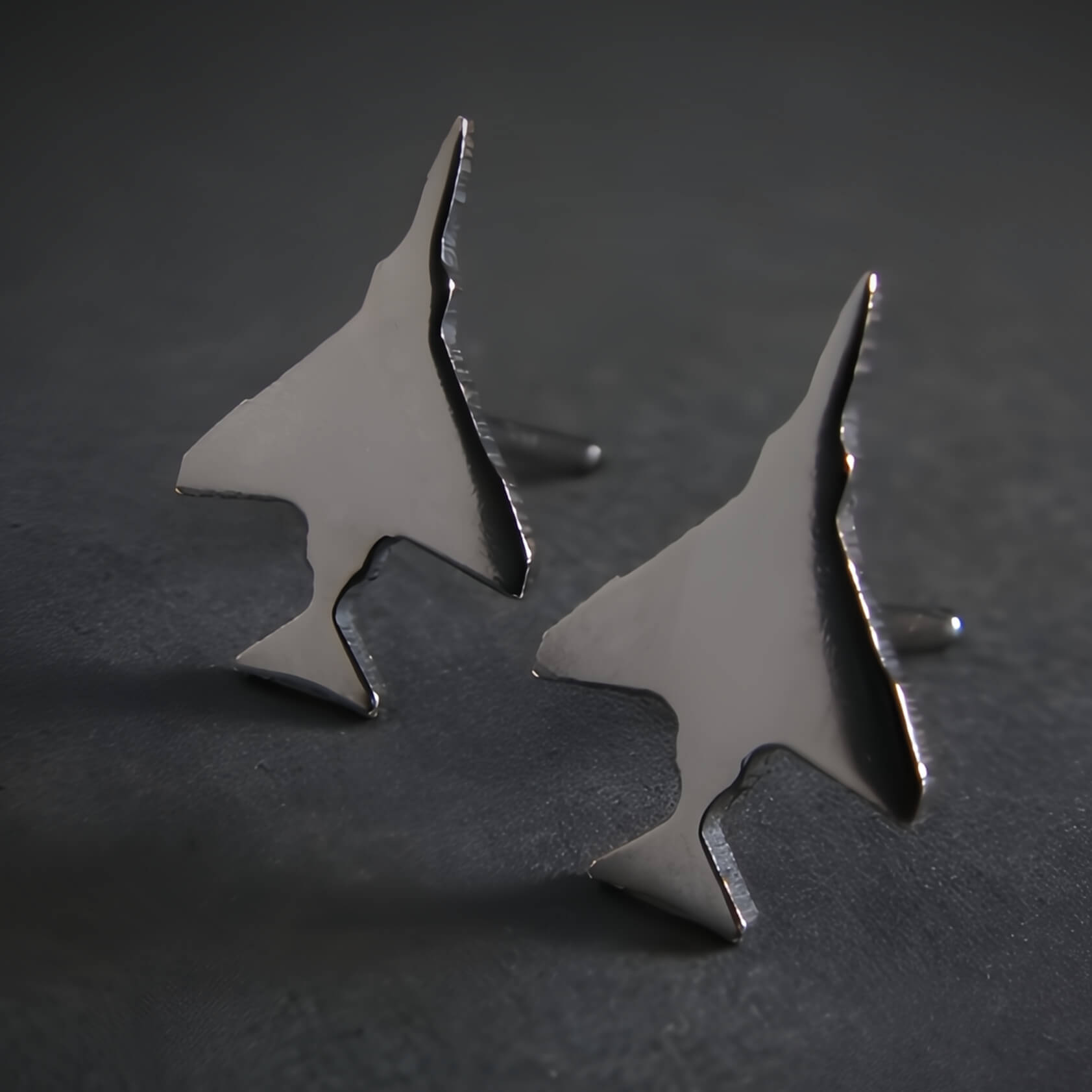 Oxidized Sterling Silver F-4 Phantom Military Jet airplane shaped earrings on a black background