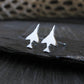 Antiqued Sterling Silver F-4 Phantom Military Jet airplane shaped earrings on a stone background