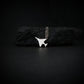 F-4 Phantom military jet airplane pendant necklace in sterling silver displayed on black stone