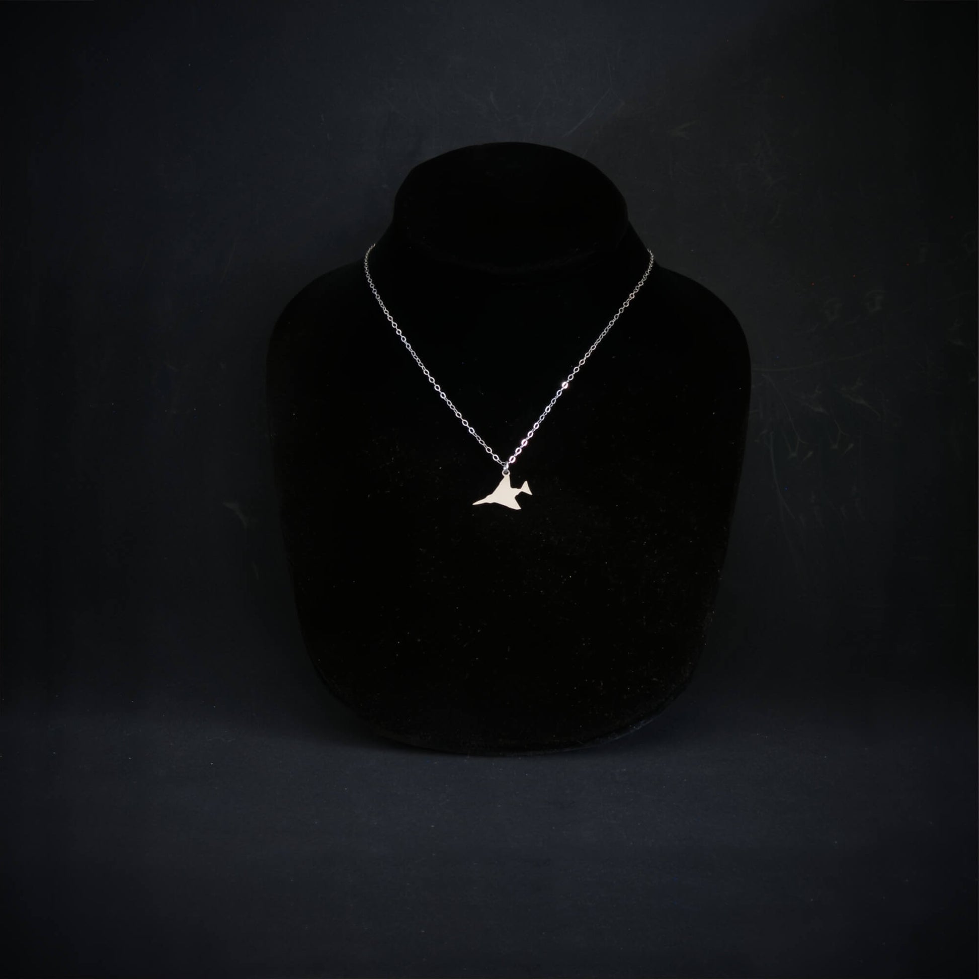 Sterling silver F-4 Phantom militariy jet airplane pendant necklace displayed on black bust