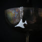 F-4 Phantom military jet airplane pendant necklace in sterling silver on wine goblet.