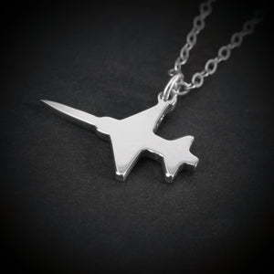 Close-up of sterling silver F-5 Freedom Fighter airplane pendant necklace – handmade aviation and military jewelry
