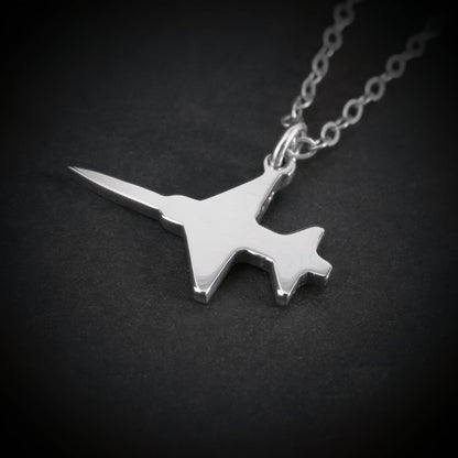 Close-up of sterling silver F-5 Freedom Fighter airplane pendant necklace – handmade aviation and military jewelry