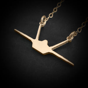 14k gold F-22 Raptor fighter jet necklace — front silhouette pendant with military edge