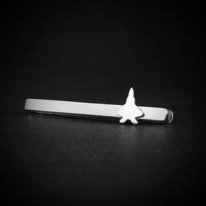 Sterling silver F-22 Raptor tie bar on dark background, military jet accessory