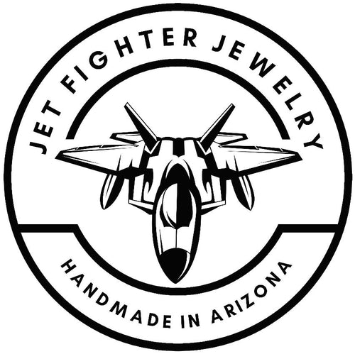 Logo of Jet Fighter Jewelry with a fighter jet design and text 'Handmade in Arizona'.
