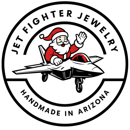 Logo of Jet Fighter Jewelry with Santa Claus on a fighter jet, set against a white background.