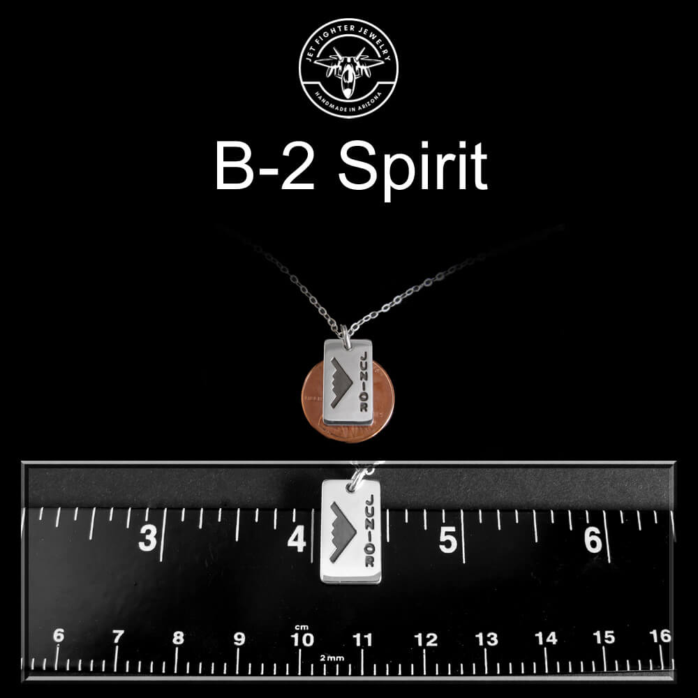 B‑2 Spirit “Junior” engraved pendant necklace size comparison – shown with penny and ruler for scale – handmade aviation jewelry