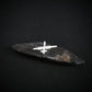 Silver MQ-9 Reaper Drone military jet airplane tie tack on a black background