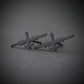 Oxidized sterling silver stud earrings shaped like the MQ-9 Reaper military drone, featuring a sleek dark finish and handcrafted aircraft silhouette, displayed on a gray background.