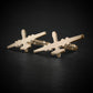Close-up of MQ-9 Reaper drone cufflinks in polished 14k gold on dark background