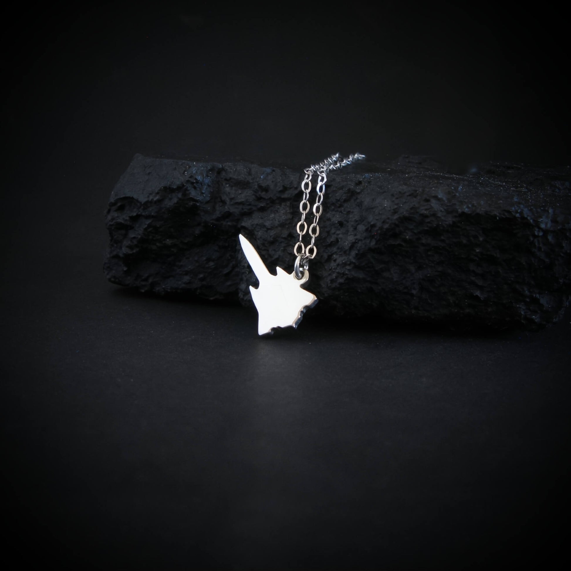 SR-71 Blackbird sterling silver jet pendant necklace on black rock aviation military jewelry