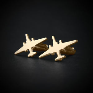 Gold U-2 Dragon Lady military airplane shaped cufflinks on a black background