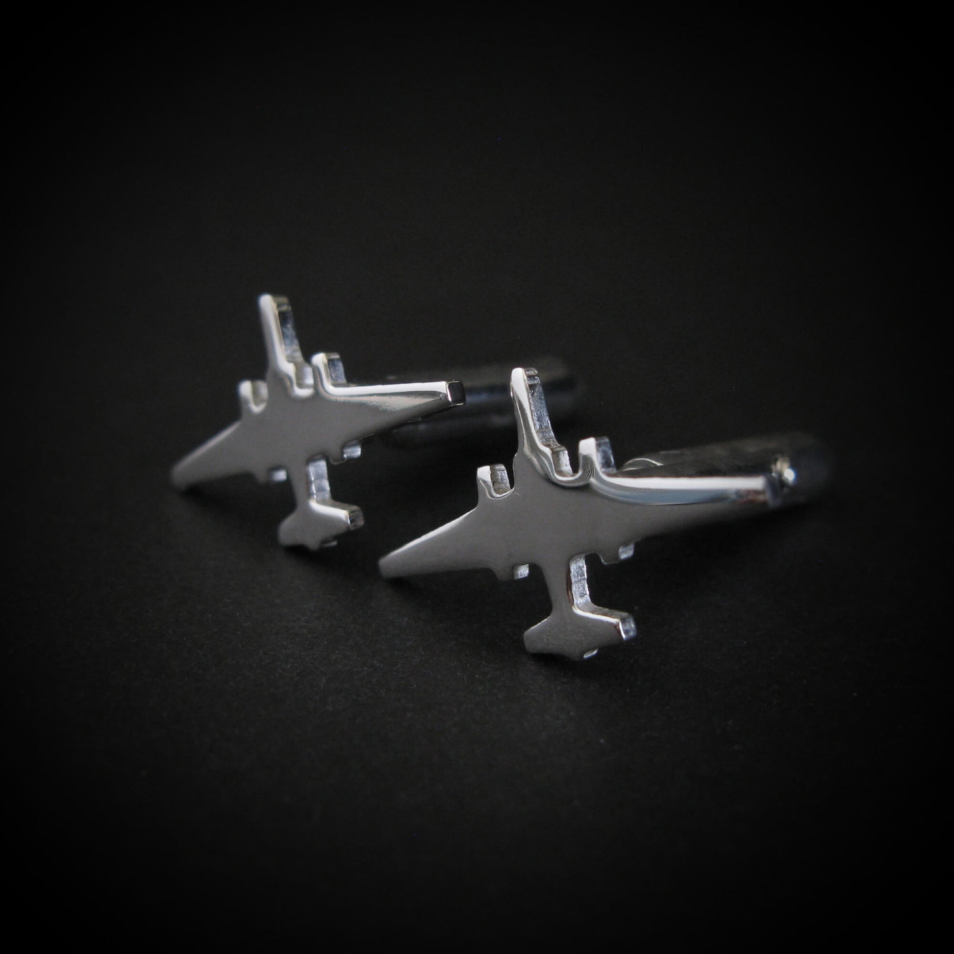 Silver U-2 Dragon Lady Military airplane-shaped cufflinks on a black background