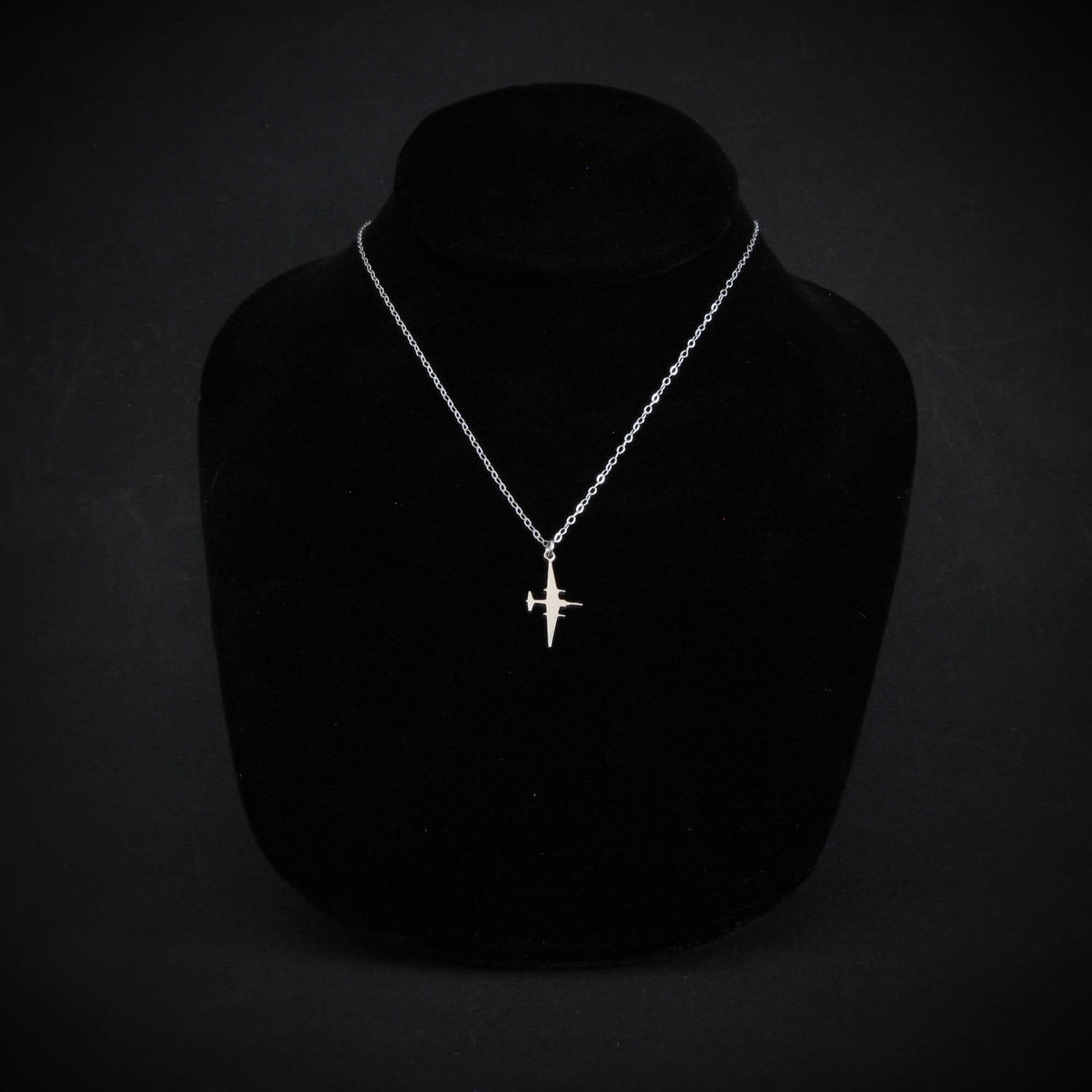 Sterling silver U-2 Dragon Lady spy plane pendant necklace on display bust by Jet Fighter Jewelry