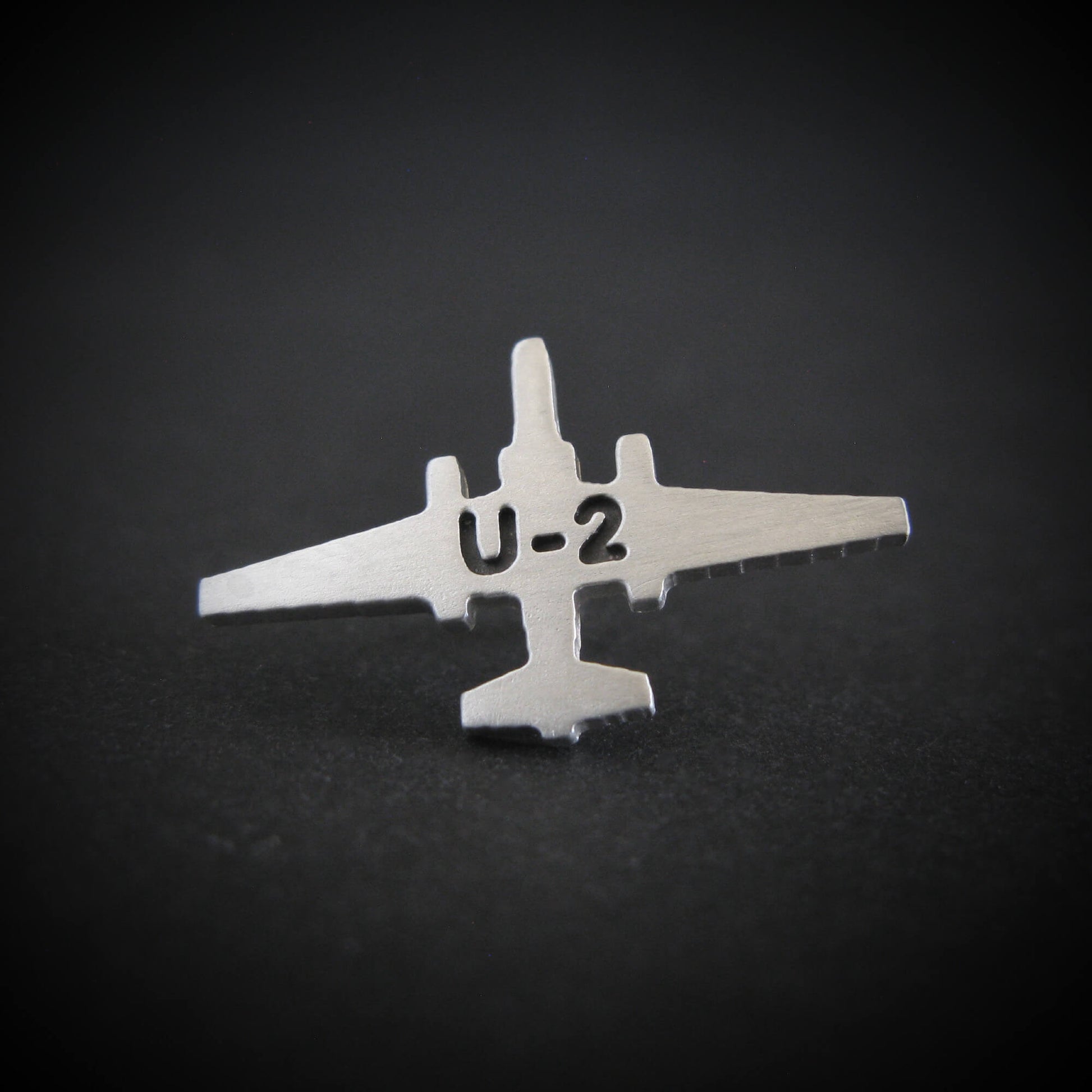Silver Engraved U-2 Spy Plane military jet airplane tie tack on a black background