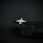 Silver U-2 spy plane military tie pin on a dark background