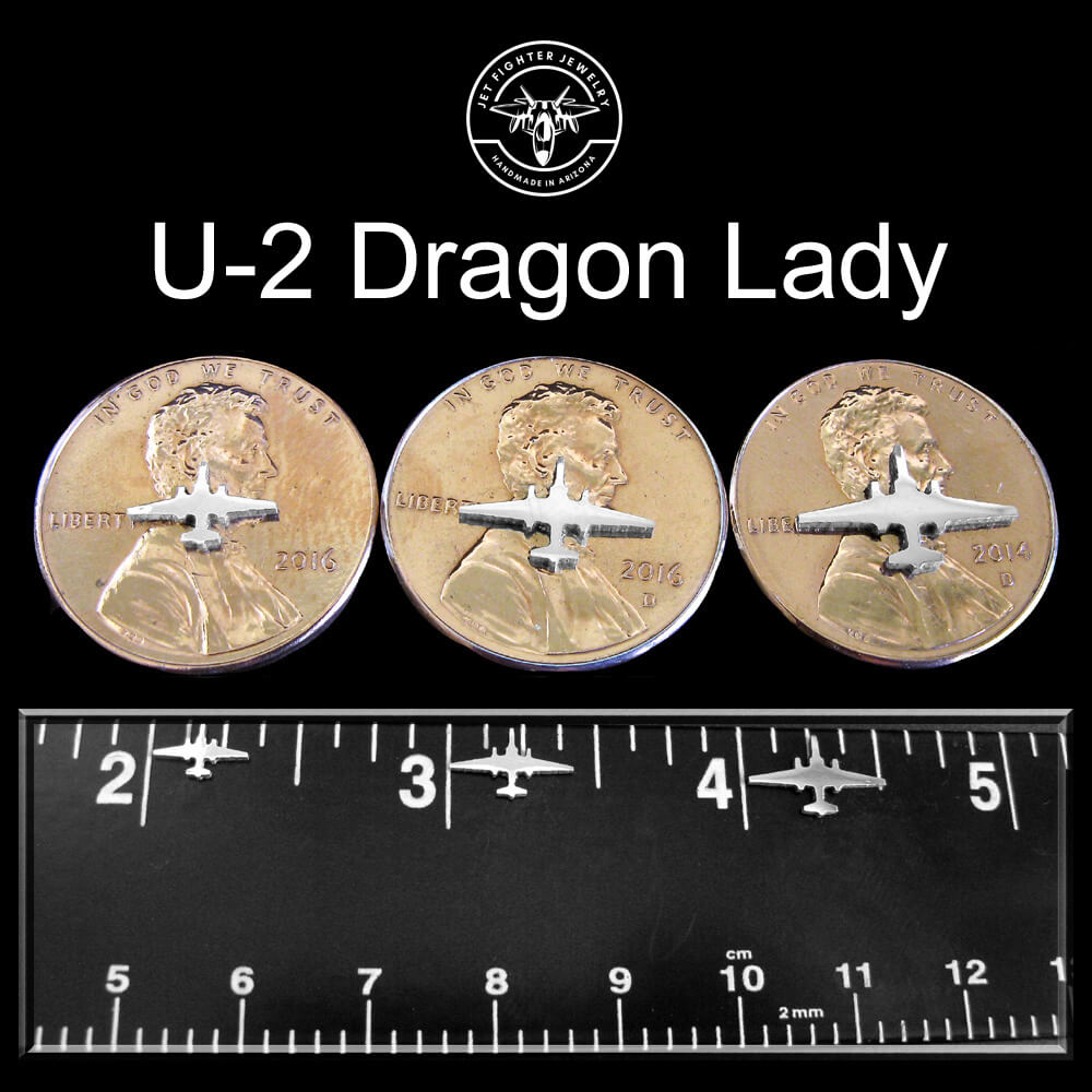 Silver silhouettes of an U-2 Military fighter jet shown on a ruler and pennies in 3 unique sizes for stud earrings