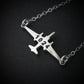 U-2 Dragon Lady military jet pendant necklace in sterling silver with engraved number “1024,” displayed close-up against a dark background.