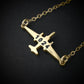 U-2 Dragon Lady military jet pendant necklace in 14k gold with engraved number “1024,” displayed close-up against a dark background.