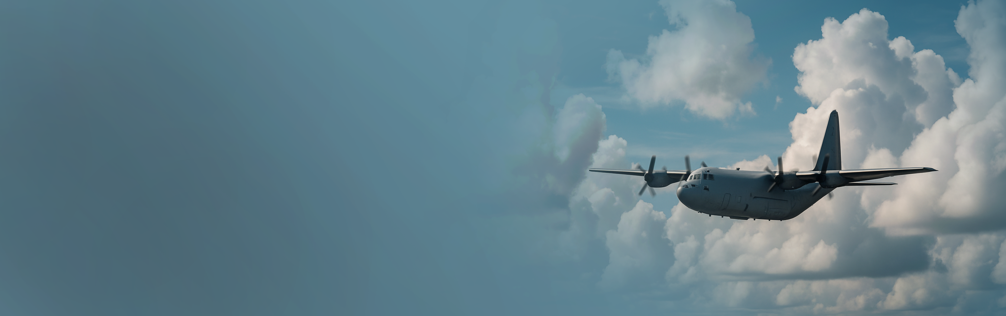 Airplane flying through a blue sky with clouds