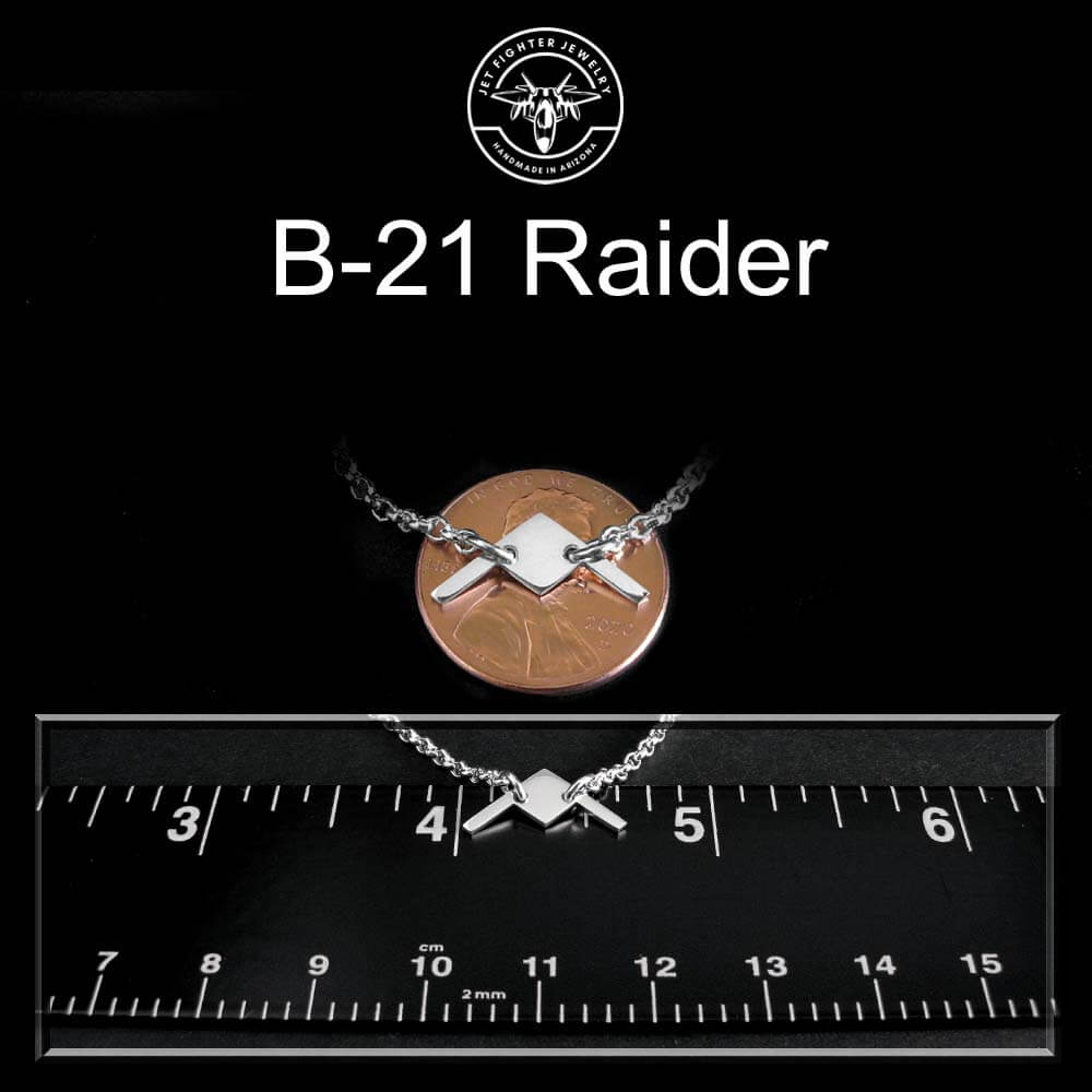 sterling silver B-21 Raider bracelet on a penny and ruler for size reference.