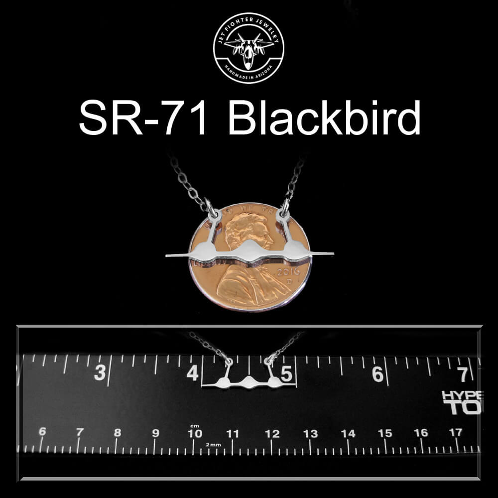 Sterling silver SR-71 pendant with 'SR-71 Blackbird' text on a black background with a ruler for scale.
