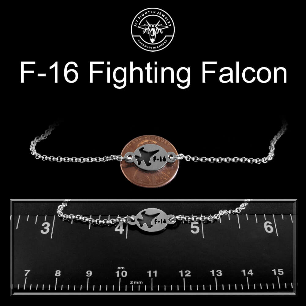 Bracelet with F-16 Fighting Falcon design on a black background with ruler for size reference.
