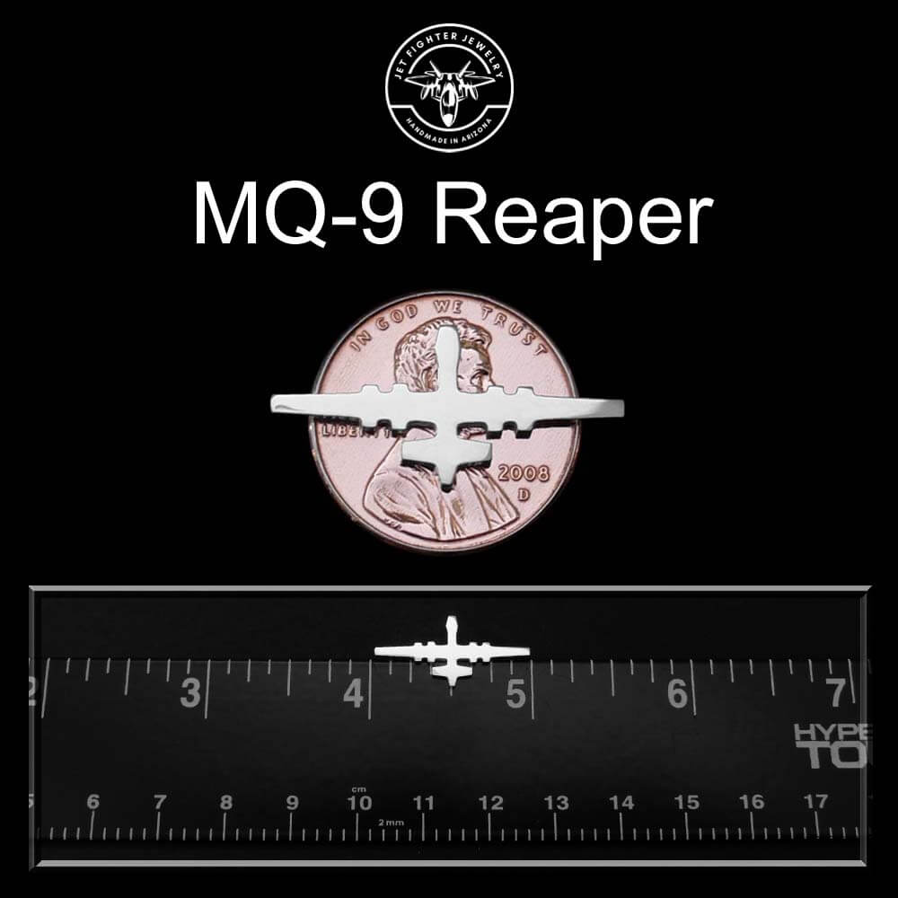 sterling silver MQ-9 Reaper tie pin tack on a black back round with a penny and ruler for scale