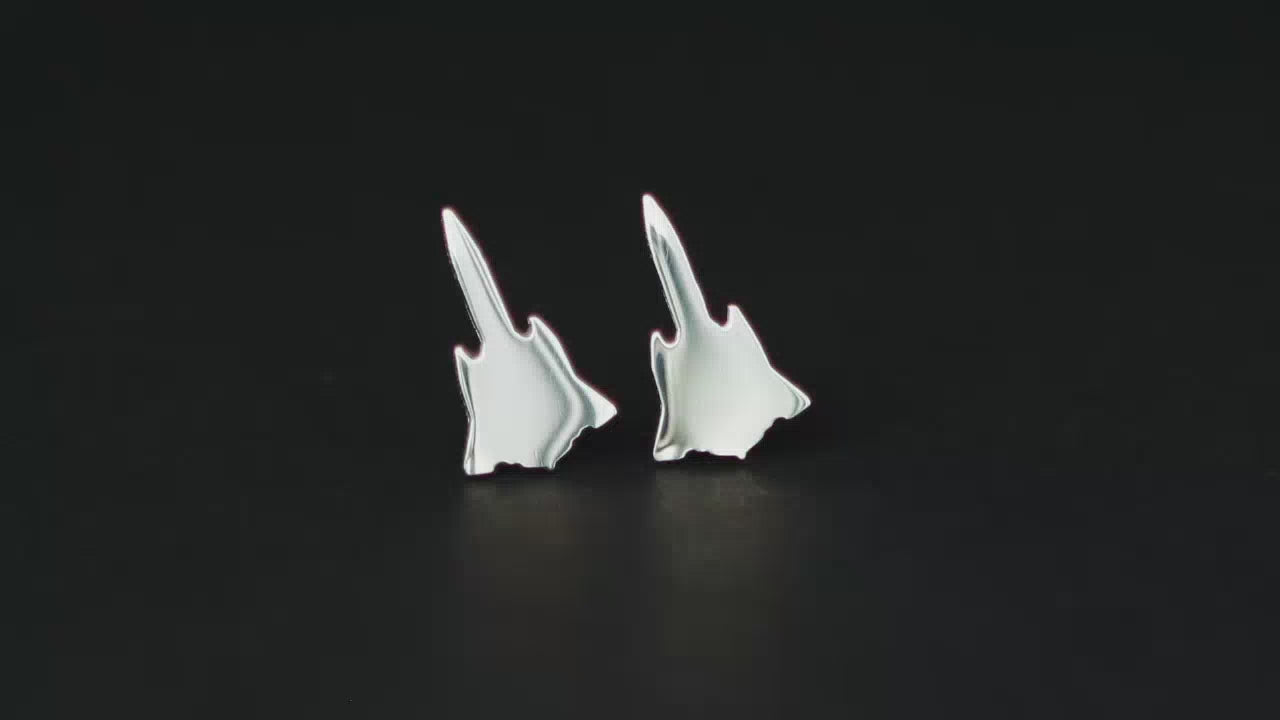 Pair of sterling silver SR-71 Military Jet Fighter Stud earrings on a turntable with a dark background