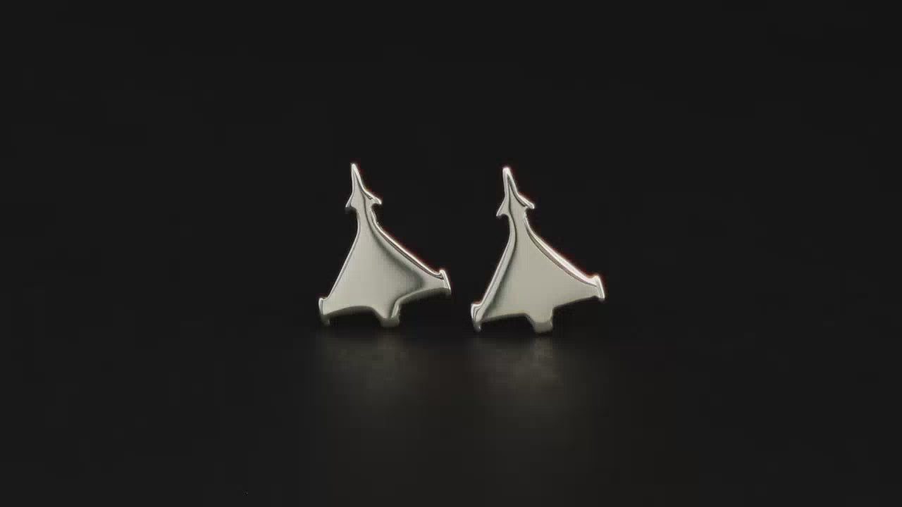 Pair of sterling silver Euro Jet Fighter stud earrings on a turntable with a dark background