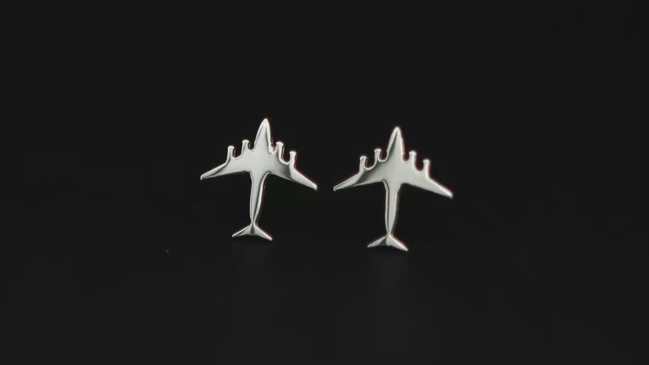 Load video: Pair of sterling silver C-17 Jet Fighter Stud Earrings on a turntable with a dark background