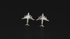 Pair of sterling silver C-17 Jet Fighter Stud Earrings on a turntable with a dark background