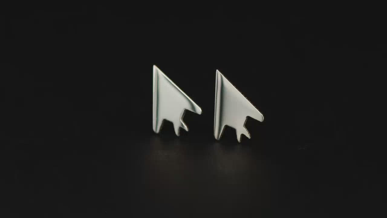 Load video: Pair of silver F-117 Jet Fighter Stud Earrings on a turntable with a dark background