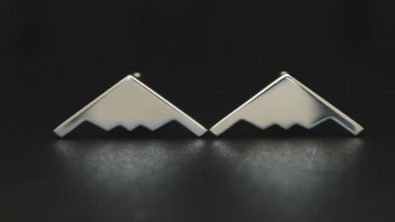 Video of B-2 Bomber Sterling silver cuff links on a black turntable handmade in the USA