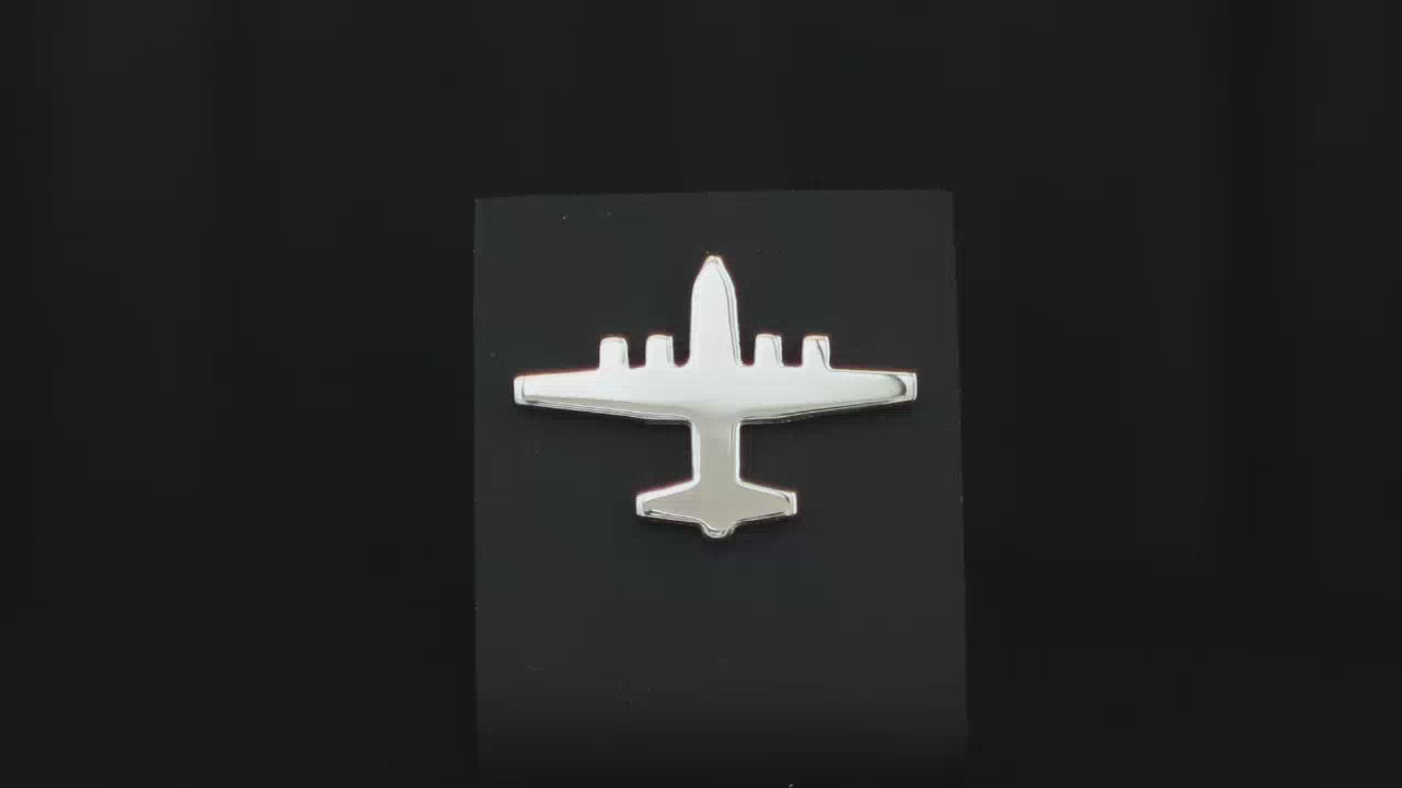 Load video: Sterling silver C-130 Hercules Tie Pin on a turntable with a dark background