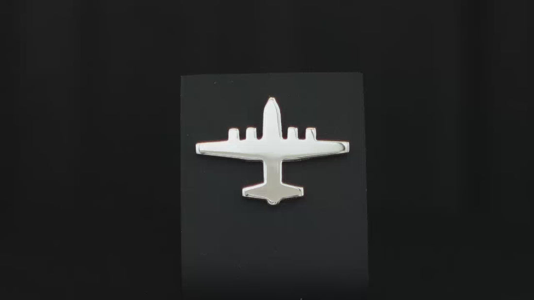 Sterling silver C-130 Hercules Tie Pin on a turntable with a dark background