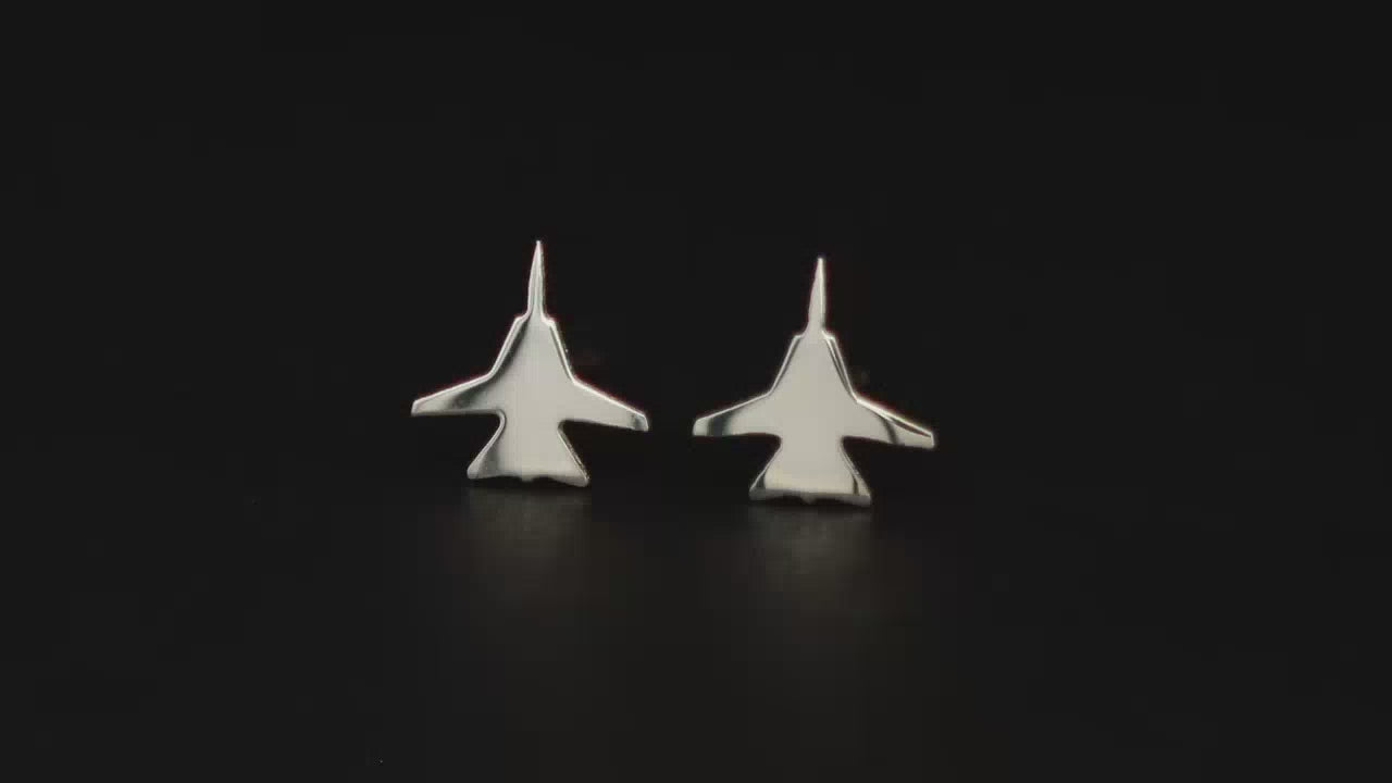 Pair of sterling silver F-14 Jet Fighter Stud earrings shown on a turntable with a dark background