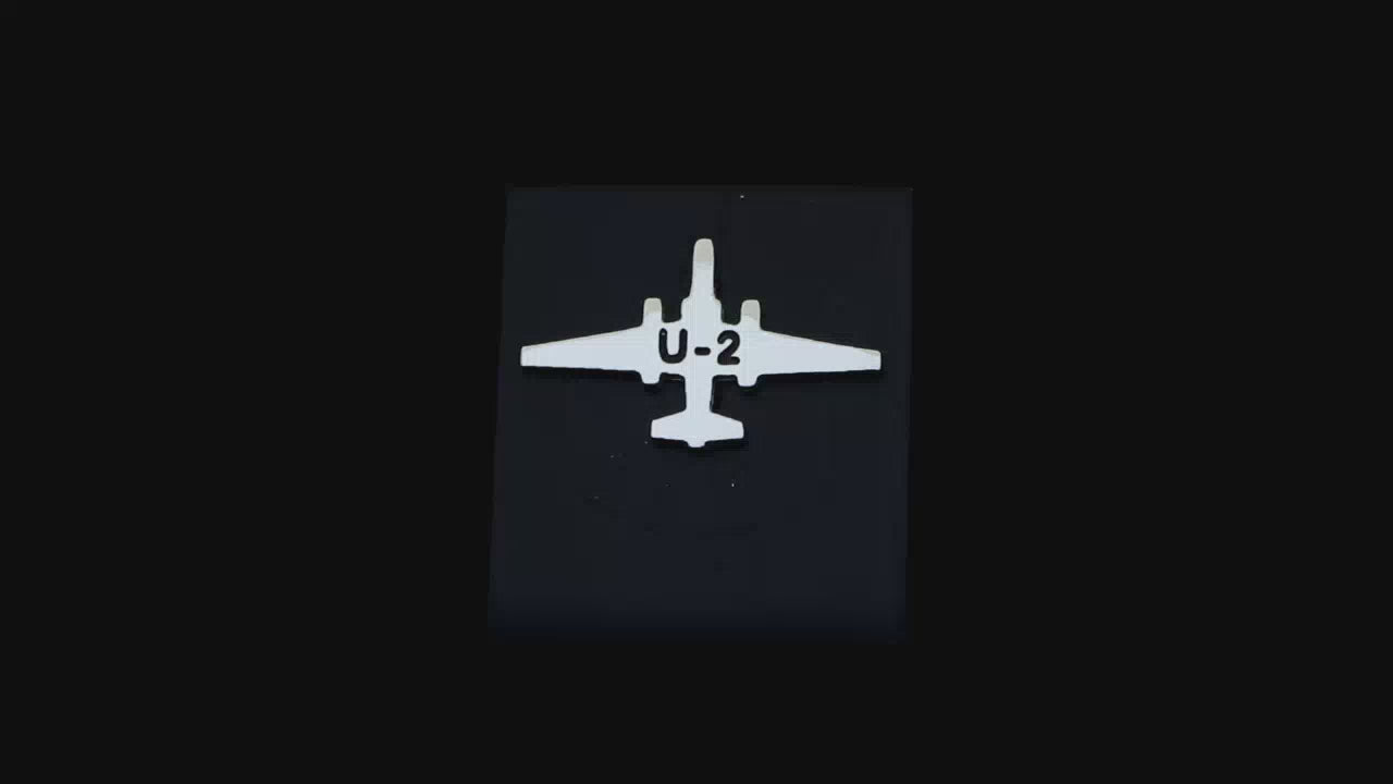 Load video: Sterling silver C-130 Hercules Tie Pin on a turntable with a dark background