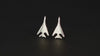 Pair of B-1 Lancer Military Jet Stud Earrings shown on a turntable with a black background