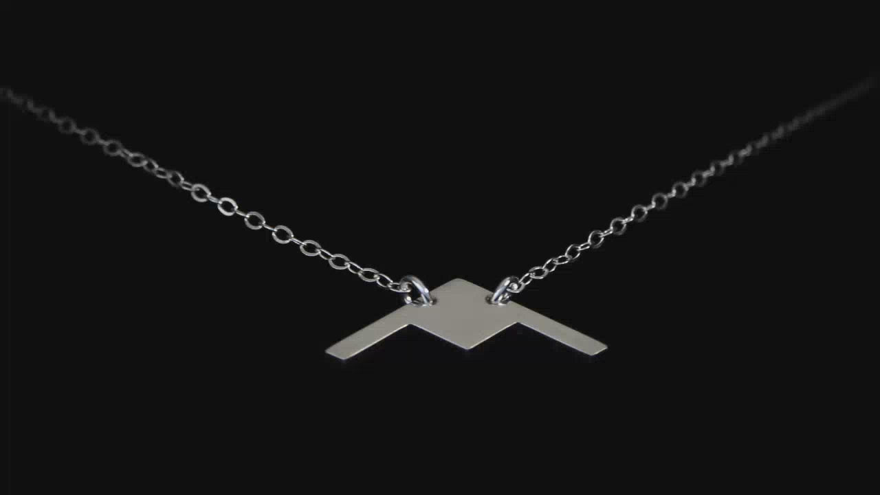 Load video: Image of a Sterling Silver B-2 Spirit Bomber Pendant going back and forth on a turntable