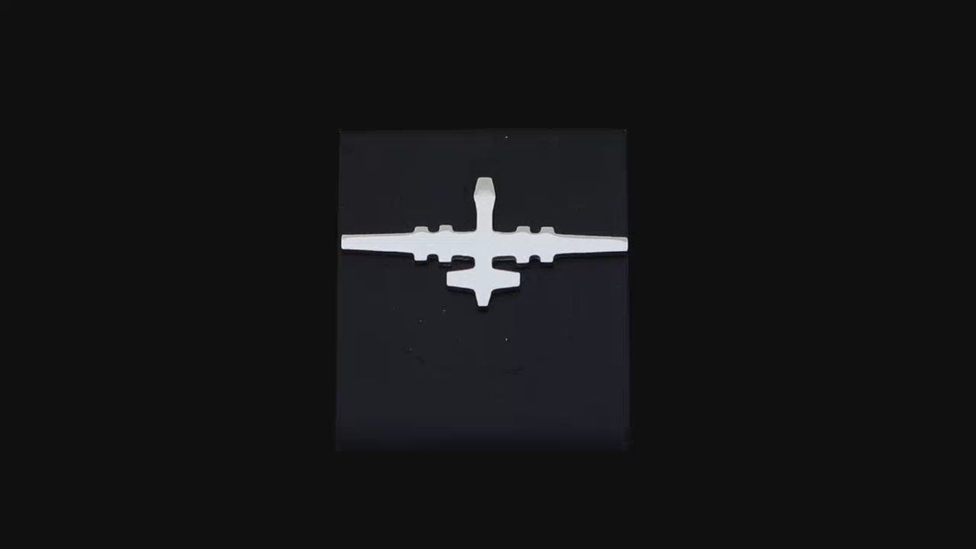 video of a MQ-9 tie tack made from sterling silver on a black background