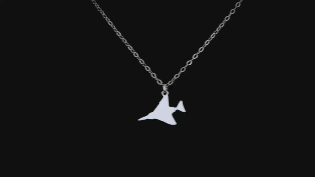 video of a F-4 Phantom II sterling silver necklace on a black background 