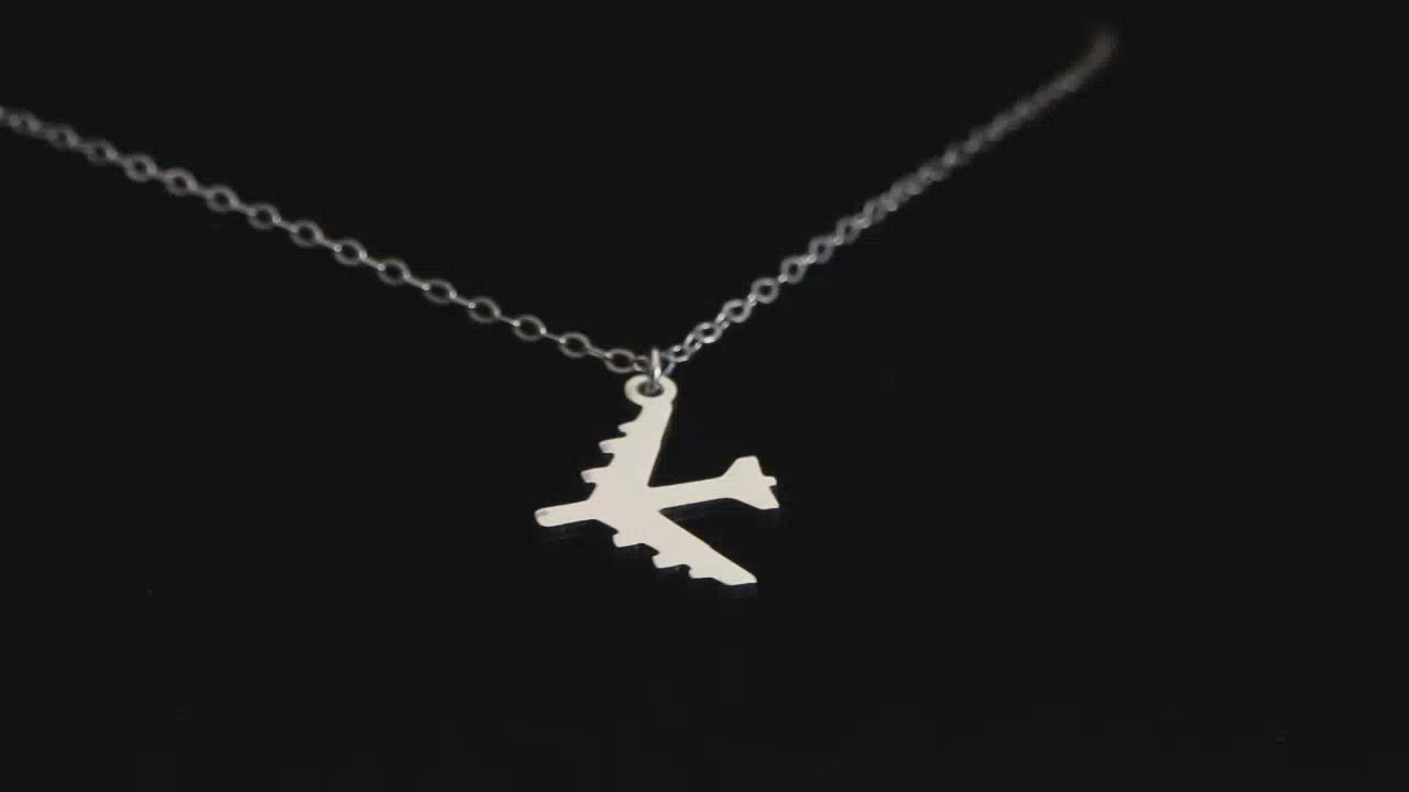 Load video: Image of Jewelry Sterling Silver B-52 Stratofortress Military Fighter Jet Pendant Necklace going back and forth on a turntable